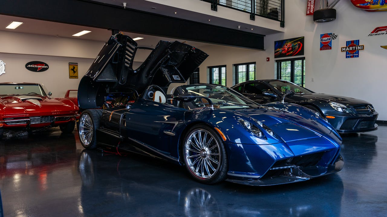 A collection of luxury sports cars displayed in a sleek, modern showroom in Illinois.